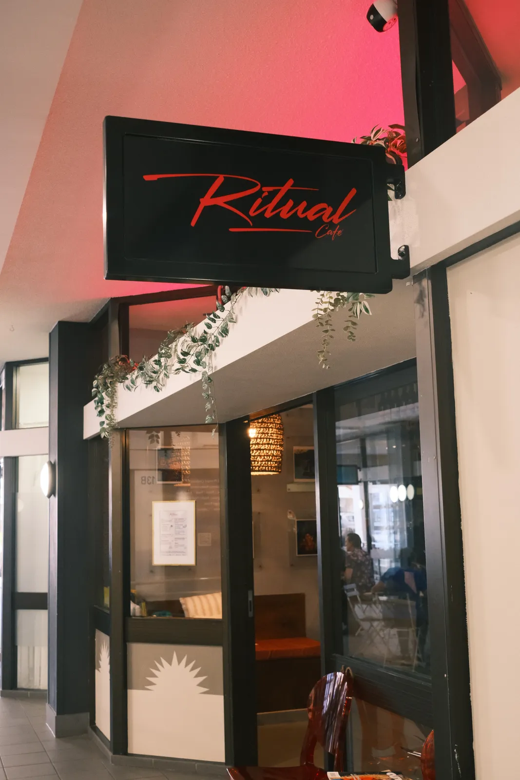 The Ritual Café sign above the entrance.