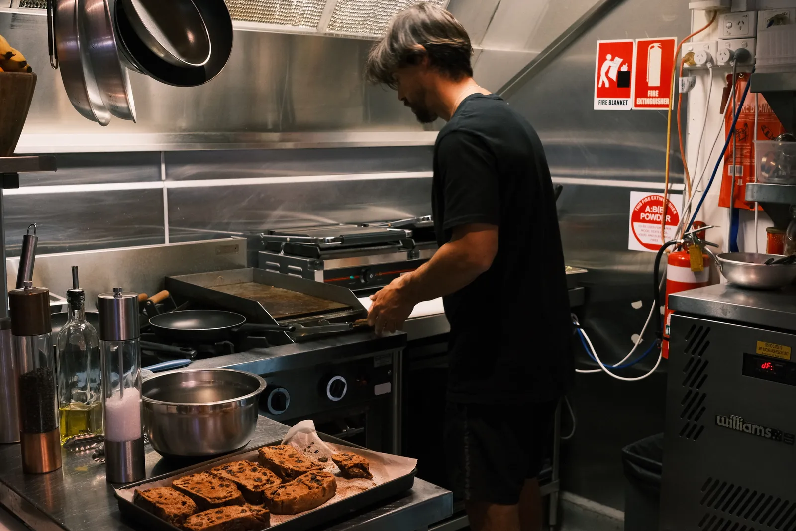 Cooking at the grill in the kitchen.